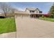 Beautiful two-story home with a well-maintained lawn and a spacious driveway leading to a three-car garage at 6220 Yellow Birch Ct, Avon, IN 46123