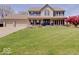 Charming two-story home featuring a manicured lawn and a welcoming front porch with wood columns at 6220 Yellow Birch Ct, Avon, IN 46123