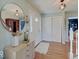 Bright foyer with hardwood floors, a decorative mirror, and a closet for convenient storage at 6220 Yellow Birch Ct, Avon, IN 46123