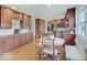Beautiful kitchen featuring wood cabinets, granite countertops, and a dining area with a cozy bench at 6220 Yellow Birch Ct, Avon, IN 46123