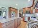 Spacious kitchen with stainless steel appliances, granite countertops, and adjacent laundry area at 6220 Yellow Birch Ct, Avon, IN 46123