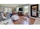 Spacious living room with hardwood floors, large windows, and a comfortable seating arrangement at 6220 Yellow Birch Ct, Avon, IN 46123