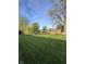 Large, level backyard featuring mature trees and ample lawn space at 6226 Fairlane Dr, Indianapolis, IN 46259