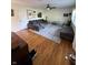 Bright living room featuring hardwood floors, stylish area rug, and comfortable seating at 6226 Fairlane Dr, Indianapolis, IN 46259