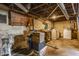 Unfinished basement with exposed pipes, concrete walls, and space for storage, laundry, and utilities at 637 Berkley Rd, Indianapolis, IN 46208