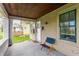 Inviting front porch features a wooden chair, brick pillars, and a view of the neighborhood at 637 Berkley Rd, Indianapolis, IN 46208