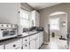 Functional kitchen featuring white cabinets, a sink and ample counter space at 637 Berkley Rd, Indianapolis, IN 46208