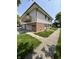 Charming exterior view showcasing a balcony, garage, and well-kept lawn at 6458 Lupine Ter, Indianapolis, IN 46224