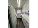 Clean kitchen with white cabinets, modern appliances, and hardwood floors at 6458 Lupine Ter, Indianapolis, IN 46224