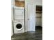 Convenient laundry area with a washer, dryer, and storage space at 6458 Lupine Ter, Indianapolis, IN 46224