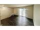 Bright living room featuring hardwood floors and a sliding glass door at 6458 Lupine Ter, Indianapolis, IN 46224