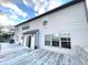 View of a home's backyard featuring a weathered wooden deck and light gray siding at 7121 Fields Way, Indianapolis, IN 46239