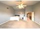 Bedroom featuring a ceiling fan, neutral walls, carpet flooring, and an open doorway to the next room at 7121 Fields Way, Indianapolis, IN 46239