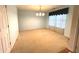 Bright, carpeted room with neutral walls, crown molding, and plenty of natural light at 7121 Fields Way, Indianapolis, IN 46239