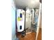 This mechanical room features a water heater and HVAC system, providing essential home services efficiently at 7121 Fields Way, Indianapolis, IN 46239