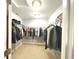 Organized walk-in closet with ample storage space and clothing racks at 7121 Fields Way, Indianapolis, IN 46239