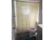 Functional bathroom with a shower-tub combo, toilet, and modern vanity at 7206 Halden Pl, Indianapolis, IN 46214