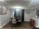 Modern dining area with a large table, stylish chairs, and ample lighting, perfect for Gathering meals at 7206 Halden Pl, Indianapolis, IN 46214
