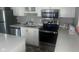 Modern kitchen featuring stainless steel appliances, white cabinets, and quartz countertops at 7206 Halden Pl, Indianapolis, IN 46214