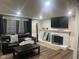 Comfortable living room with a fireplace, leather furniture, and stylish decor at 7206 Halden Pl, Indianapolis, IN 46214