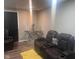 Cozy living room featuring leather seating, contemporary decor, and a decorative table at 7206 Halden Pl, Indianapolis, IN 46214