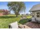 Expansive backyard with a water feature, mature trees, gazebo, and a deck ideal for outdoor living at 7280 E Patricia Dr, Camby, IN 46113