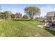 Expansive backyard with lush lawn, mature trees, and outdoor seating perfect for entertaining at 7280 E Patricia Dr, Camby, IN 46113