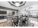 Open-concept dining area featuring a modern light fixture, stylish decor, and seamless flow into the kitchen at 7280 E Patricia Dr, Camby, IN 46113