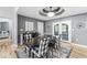 Dining room with a large table, patterned chairs, and elegant lighting at 7280 E Patricia Dr, Camby, IN 46113