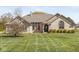 Charming single-story brick home with a well-manicured lawn and mature landscaping at 7280 E Patricia Dr, Camby, IN 46113