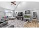 Comfortable living room featuring vaulted ceilings and hardwood floors at 7280 E Patricia Dr, Camby, IN 46113