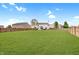 Spacious backyard featuring well-maintained lawn and privacy fence at 825 Palisades Ct, Greenwood, IN 46143