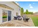 Spacious wooden deck with outdoor seating, perfect for entertaining and relaxing, with view of the lawn at 825 Palisades Ct, Greenwood, IN 46143