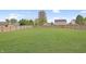 A sprawling backyard featuring lush green grass and a sturdy wooden fence, offering privacy at 825 Palisades Ct, Greenwood, IN 46143