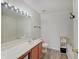 Bathroom features a vanity with ample counter space, bath tub, and vinyl flooring at 825 Palisades Ct, Greenwood, IN 46143