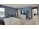 Bedroom with blue walls, carpet flooring, and natural light at 825 Palisades Ct, Greenwood, IN 46143