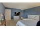 Bedroom with blue walls, carpet flooring, and a white dresser at 825 Palisades Ct, Greenwood, IN 46143