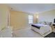 Bedroom with yellow walls, white trim, carpet flooring and a white dresser at 825 Palisades Ct, Greenwood, IN 46143