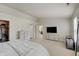Bright main bedroom with two windows, neutral carpet, dressers, and access to the closet at 825 Palisades Ct, Greenwood, IN 46143