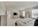 Spacious main bedroom with natural light, neutral carpet, and a view to the yard at 825 Palisades Ct, Greenwood, IN 46143