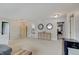 Open bonus room boasts neutral carpet, modern furniture and decor, and easy access to multiple bedrooms at 825 Palisades Ct, Greenwood, IN 46143