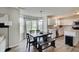 Bright dining area with access to the backyard, adjacent to the modern kitchen at 825 Palisades Ct, Greenwood, IN 46143