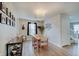 Cozy dining area features a chandelier, table, and access to the stairs at 825 Palisades Ct, Greenwood, IN 46143