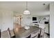 Inviting dining space with a view into the living area, enhanced by stylish lighting at 825 Palisades Ct, Greenwood, IN 46143