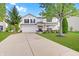 Inviting two-story home boasts a well-maintained lawn and attached two-car garage at 825 Palisades Ct, Greenwood, IN 46143