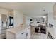 Contemporary kitchen with island, stainless steel refrigerator, and view of the adjacent living room at 825 Palisades Ct, Greenwood, IN 46143