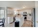 Modern kitchen featuring white cabinets, stainless steel appliances, and a center island at 825 Palisades Ct, Greenwood, IN 46143