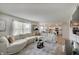 Bright, open living room featuring plush seating and hardwood flooring at 825 Palisades Ct, Greenwood, IN 46143