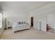 Calm main bedroom with natural light, neutral colors, and carpet flooring at 825 Palisades Ct, Greenwood, IN 46143