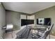 Office with a large desk, monitor, and modern decor at 825 Palisades Ct, Greenwood, IN 46143